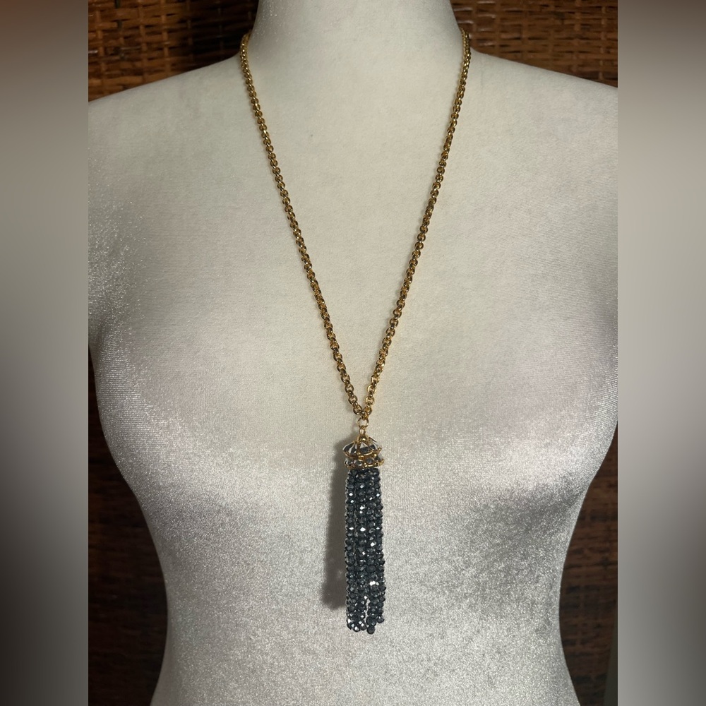 Gold tone tassel necklace with rhinestones
